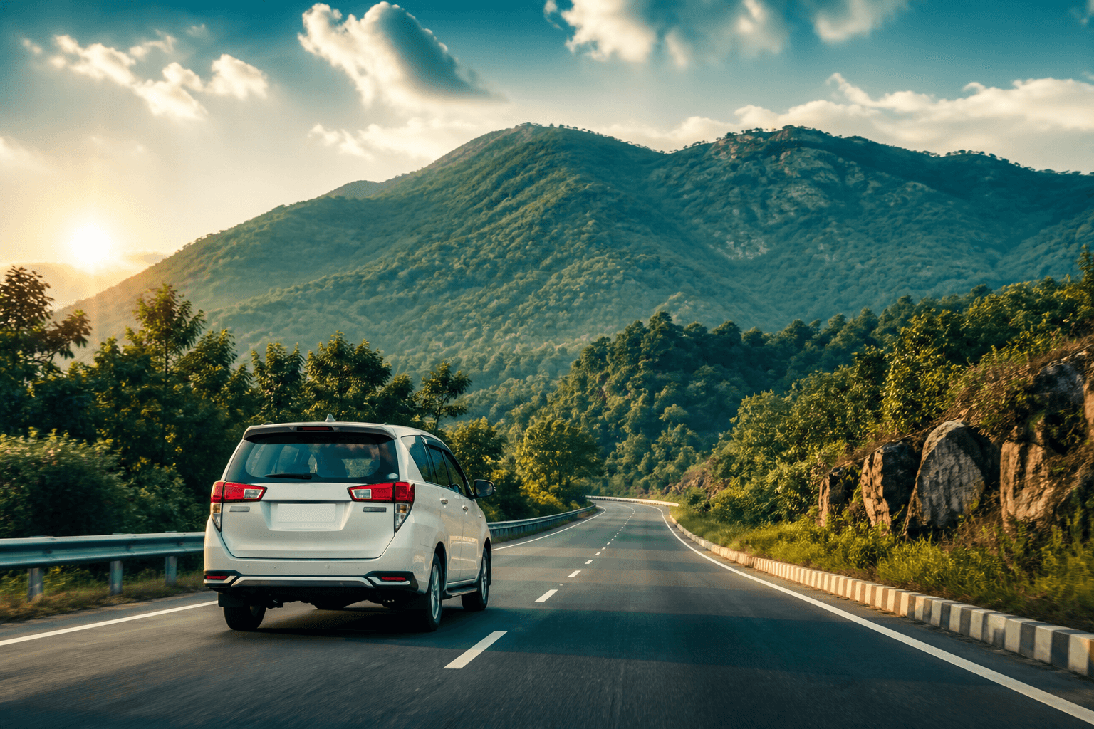 White Rathya SUV on a scenic highway toward green Jharkhand hills